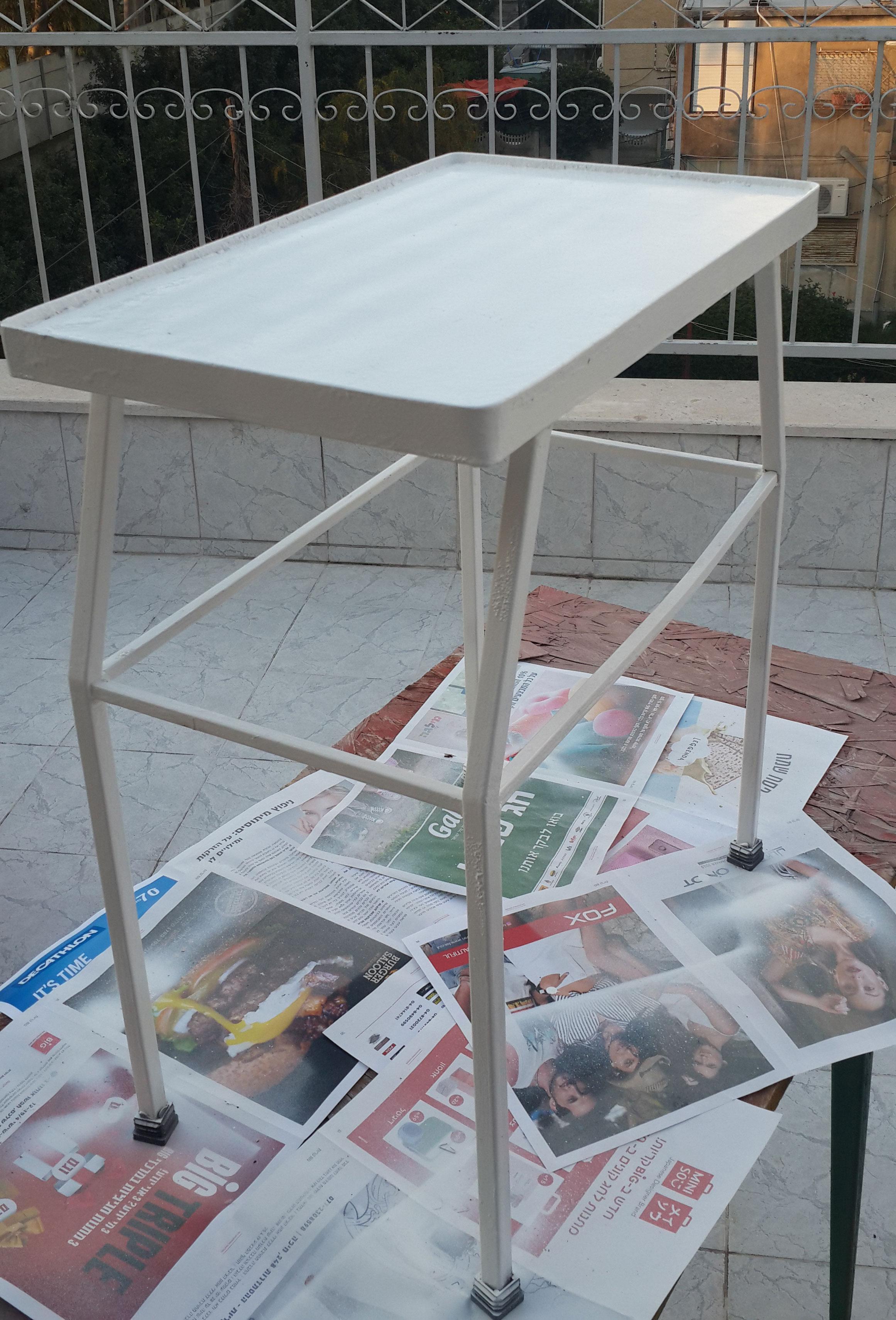 View of empty fresh painted iron tea table