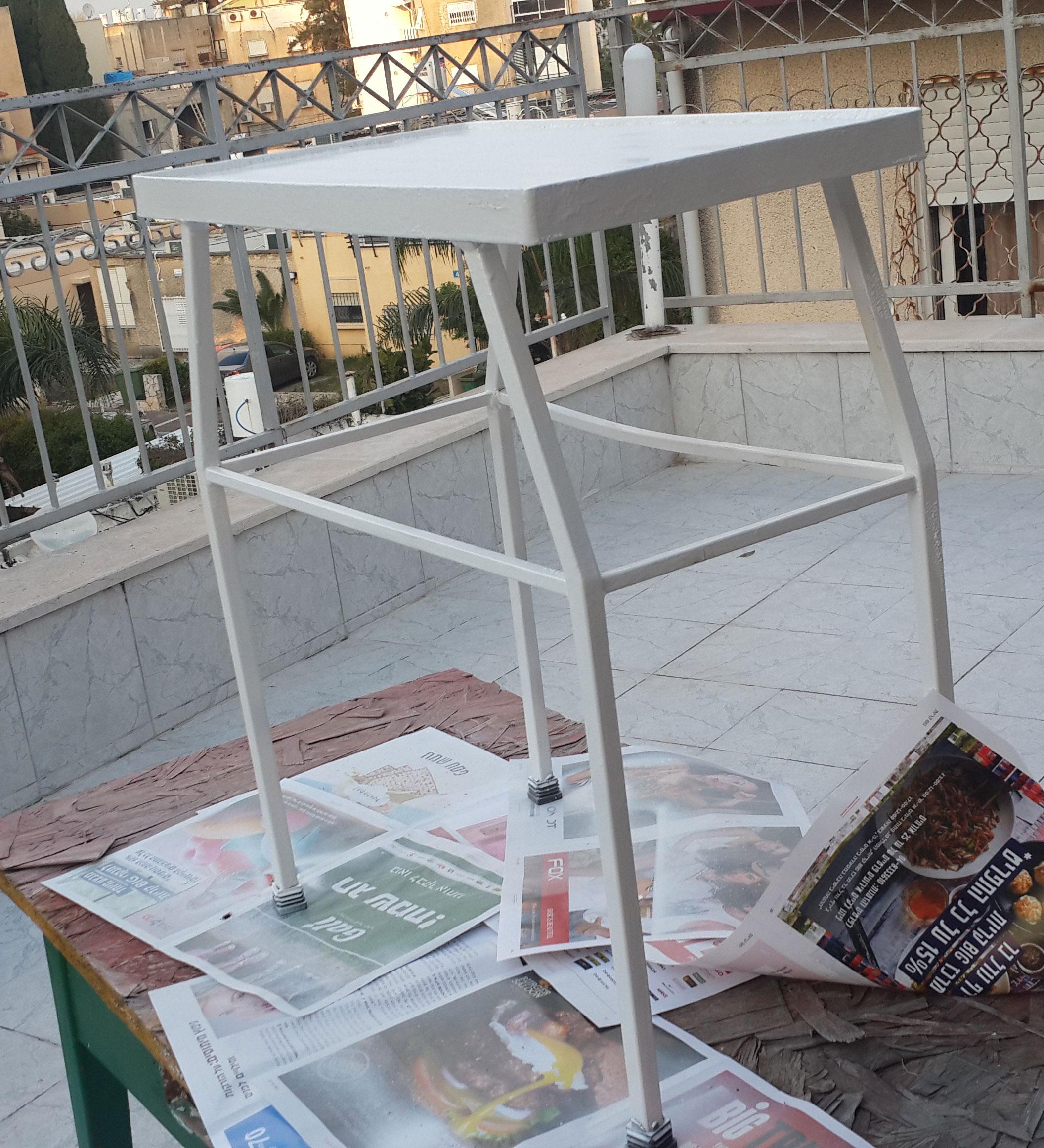 Another view of empty fresh painted iron tea table