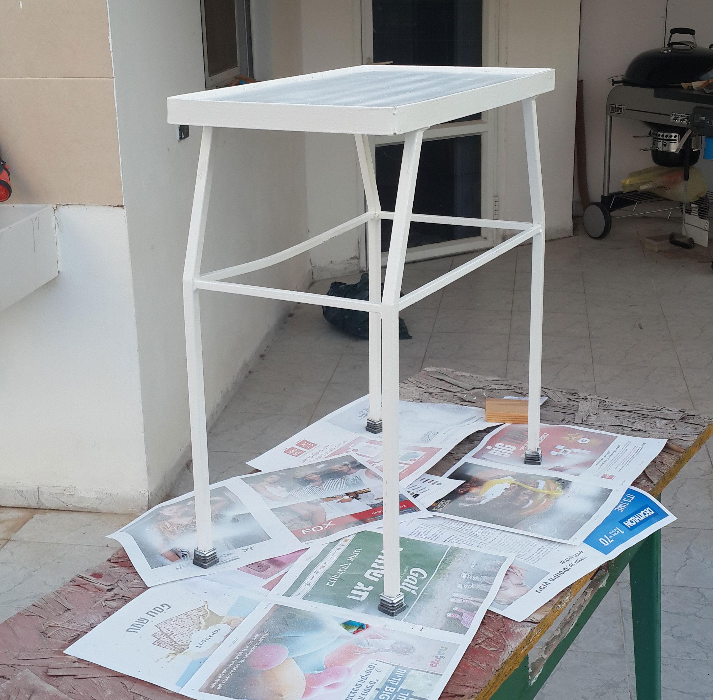 Another view of empty fresh painted iron tea table