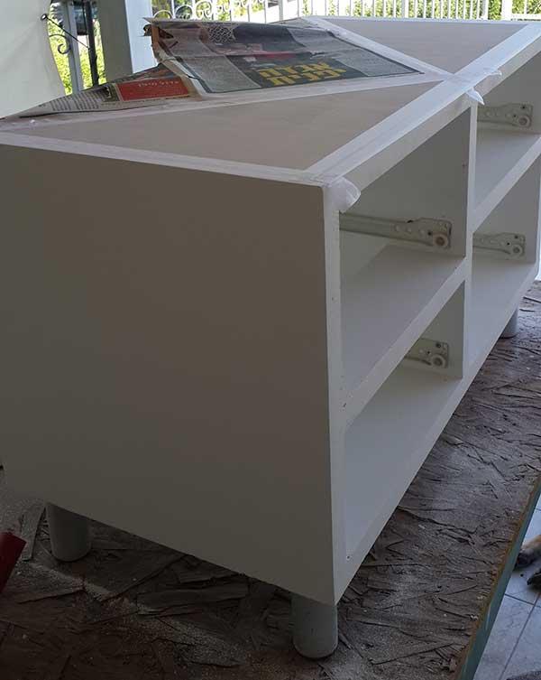 side look, top covered with type and paper, showing exposed triangle, ready to be painted